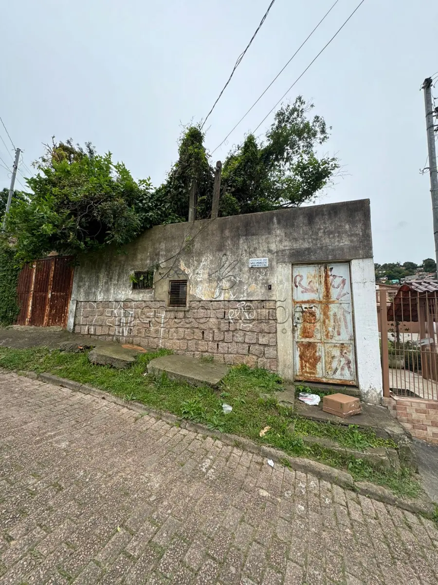 LOTE 000 - UM IMÓVEL LOCALIZADO EM PORTO ALEGRE NA RUA DONA FIRMINA, 1254, BAIRRO SÃO JOSÉ,  MEDINDO 9,90m  DE FRENTE POR 56,50m DE EXTENSÃO DA FRENTE AO FUNDO